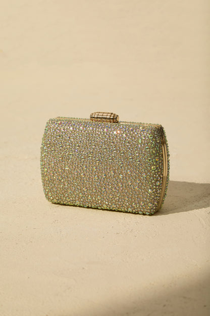 Clutch de cristales, en mano