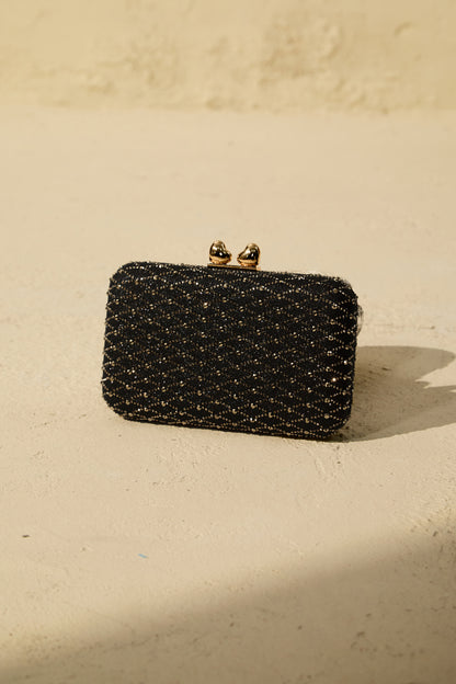 Clutch tipo caja de cristales, detalle