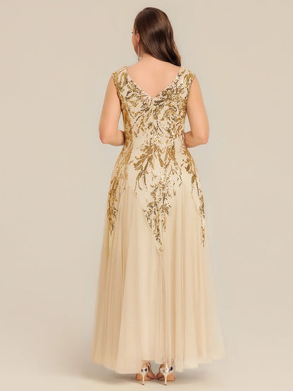 Vestido largo de tul bordado en dorado