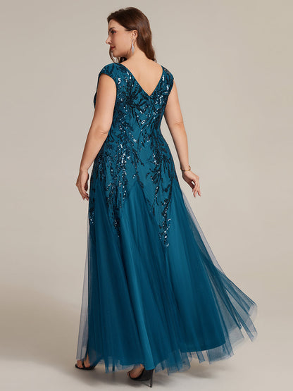 Vestido largo de tul bordado en azul petróleo