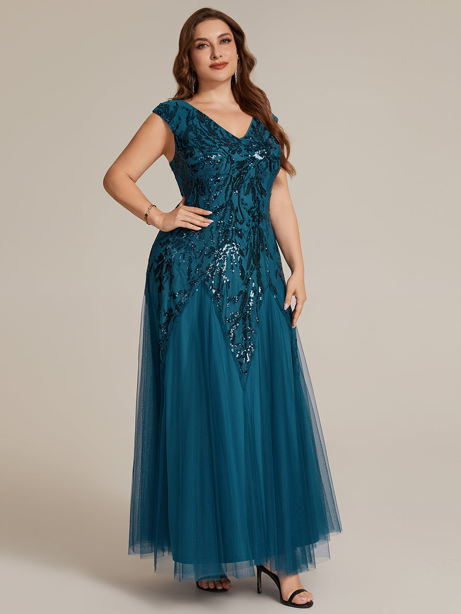 Vestido largo de tul bordado en azul petróleo, detalle