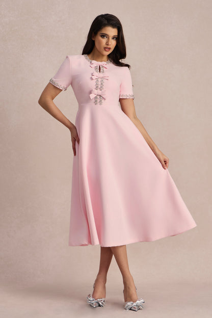 Vestido midi rosa con lazo y cristales